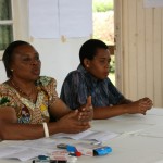 A droite, Mathilde M. prononçant le mot d'ouverture accompagnée d'Anne Bisimwa, Animatrice  de Caucus des Femmes  